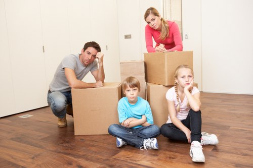 Careful loading of household items for a Grovepark relocation
